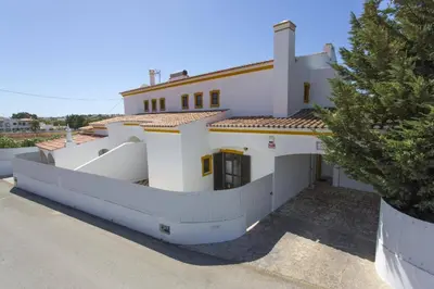 a white house with a fence in front of it at Villa Luis Gale by Villa Plus in Galé