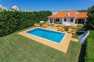 a house with a swimming pool in the yard at Villa Lurdes by Villa Plus in Galé