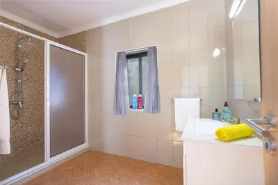 a bathroom with a shower and a sink at Villa Lurdes by Villa Plus in Galé