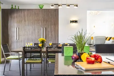 a dining room with tables and fruits on a cutting board at Loendros, Calma Moradia com Piscina Privada, Guia in Guia