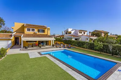 a house with a swimming pool in front of a yard at Villa Tadeu Quatro by Villa Plus in Azinhal