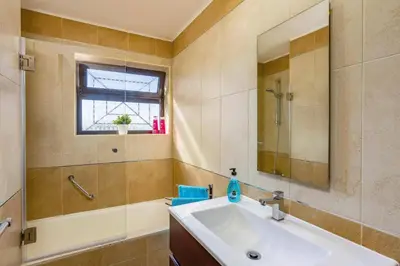 a bathroom with a sink and a mirror at Villa Tadeu Quatro by Villa Plus in Azinhal