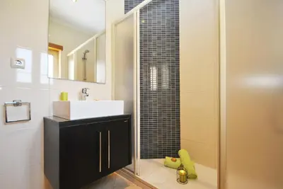 a bathroom with a sink and a shower at Villa Anna by Algarve Vacation in Albufeira