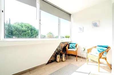 a dishwasher in a kitchen with its door open at Spacious 1 bed in Vilamoura, Fast Wifi & Pool in Quarteira