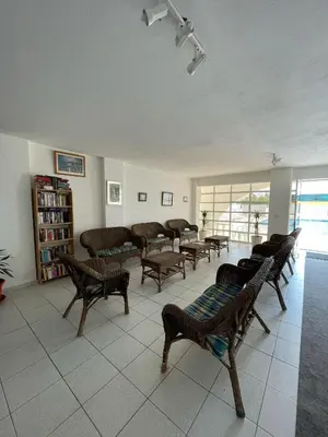 a room with a bunch of chairs in a room at Apartamento T1 todo equipado in Albufeira