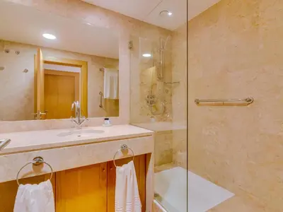 a bathroom with a sink and a shower at AL - Vila Sol Golfside Ground Floor in Vilamoura