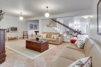 a living room with a couch and a table at Villa Costa Rica in Galé