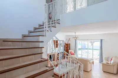 a staircase in a home with a living room at Villa Sofy in Galé
