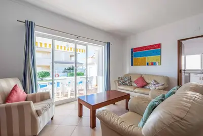 a living room with a couch and a table at Villa Sofy in Galé