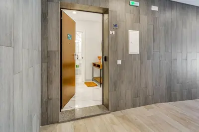 a hallway with a door leading into a room at Sublime and Bright 2 BDR Apartment by LovelyStay in Quarteira
