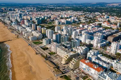an aerial view of a beach and buildings at Sublime and Bright 2 BDR Apartment by LovelyStay in Quarteira
