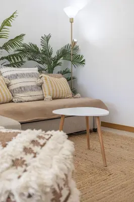 a living room with a couch and a coffee table at Modern 1BR Apartment in Central Albufeira with Balcony & Parking, by Hopstays in Albufeira