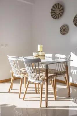 a dining room with a table and chairs at Modern 1BR Apartment in Central Albufeira with Balcony & Parking, by Hopstays in Albufeira