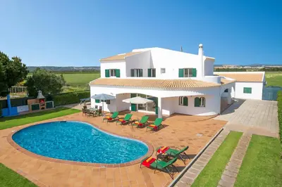 an image of a villa with a swimming pool at Villa Sandra by Villa Plus in Olhos de Água