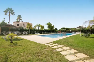 a swimming pool in a yard with a resort at Condomínio Quinta do Vale in Guia