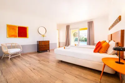 a bedroom with a large bed and a desk at Villa Eagles Nest by Algarve Vacation in Albufeira