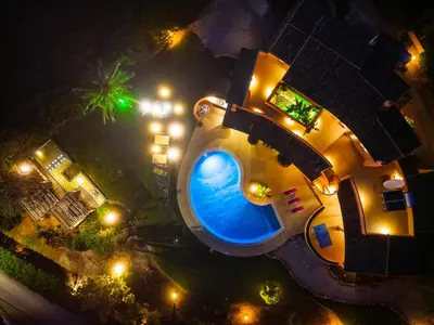 an overhead view of a house with a swimming pool at night at Villa Eagles Nest by Algarve Vacation in Albufeira