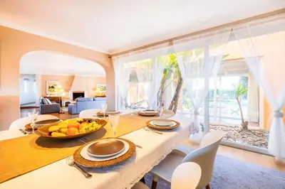 a dining room with a table with a bowl of fruit on it at Villa Eagles Nest by Algarve Vacation in Albufeira