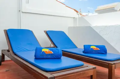 two beds in a room with blue and white at #197 Casa Gili by Home Holidays in Albufeira