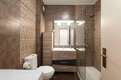 a bathroom with a toilet and a sink and a shower at The Albufeira Concierge - Albufeira City Center in Albufeira