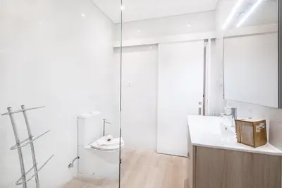 a bathroom with a sink and a mirror at Guerreiros Lovely Stay in Albufeira