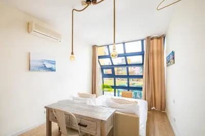 a dining room with a table and a window at Anabella Guest House in Albufeira