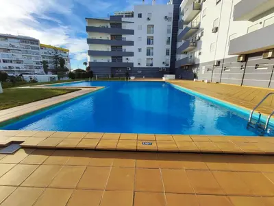 a swimming pool in the middle of a building at Albufeira Vintage Apartment 1 With Pool by Homing in Albufeira