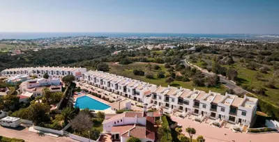 an aerial view of a resort with a swimming pool at Three Bedroom Sea View Townhouse Villa in Albufeira