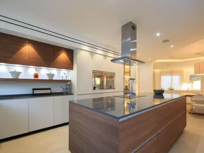 a kitchen with a large island in the middle at Contemporary Vilamoura Villa Stunning Open Plan Design Villa Azure Elegance in Quarteira