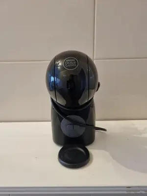 a black coffee cup sitting on top of a counter at The Albufeira Concierge - Prime Beach Center L3 in Albufeira