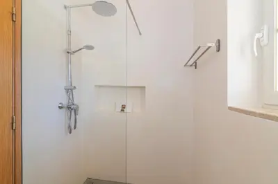 a shower with a glass door in a bathroom at Vilamoura - VILLA VINTE in Vilamoura