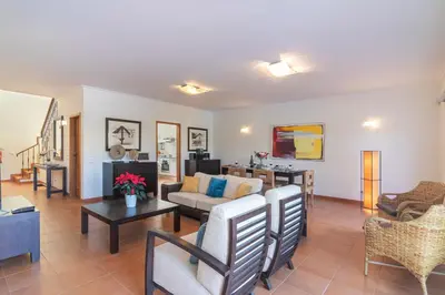 a living room with a couch and a table at Vilamoura - VILLA VINTE in Vilamoura