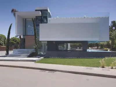a building with a large white sign on top of it at Phenomenal Algarve Villa Villa Flowerscape 4 Bedrooms Steam Room & Home in Almancil