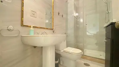 a bathroom with a sink and a toilet and a staircase at Intemporal Duplex Marina T2 HsR Marina Vilamoura in Vilamoura