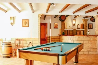 a pool table in the middle of a room at Villa Punta Cana by Algarve Vacation in Albufeira