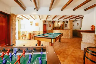 a living room with a pool table in it at Villa Punta Cana by Algarve Vacation in Albufeira