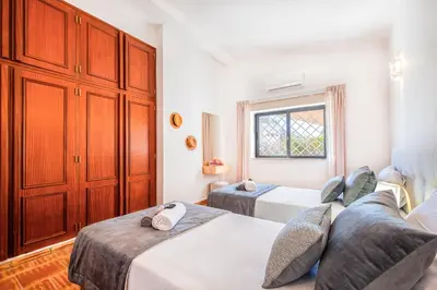 a bedroom with two beds and a window at Villa Shangri-La by Algarve Vacation in Albufeira