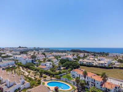 an aerial view of a city with houses and a swimming pool at Villa Periquito 2BD Pool Fast WiFi AC Garden in Albufeira