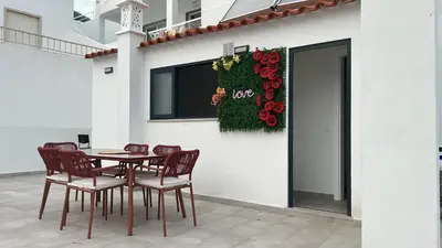 a table and chairs in front of a building at Boutique Style Town House in Albufeira