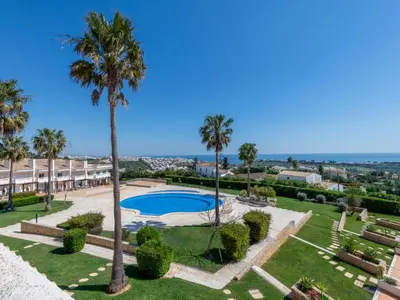a large swimming pool in front of a building at Apartment Aguia M T2 - VIP Properties by Interhome in Albufeira