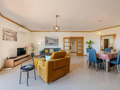 a living room with a couch and a table at Apartment Aguia M T2 - VIP Properties by Interhome in Albufeira
