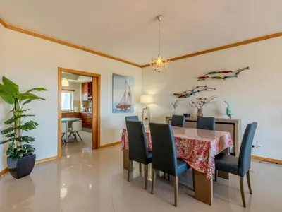 a living room with a yellow couch and a table at Apartment Aguia M T2 - VIP Properties by Interhome in Albufeira