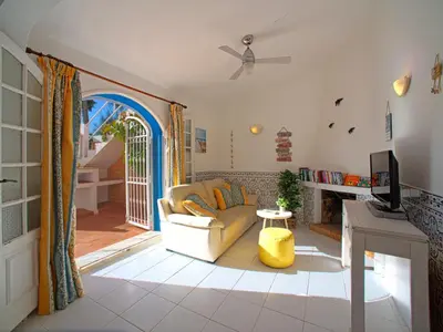 a living room with a couch and a tv at Villa Fernandes by Interhome in Albufeira