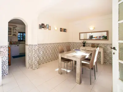 a kitchen and dining room with a table and chairs at Villa Fernandes by Interhome in Albufeira
