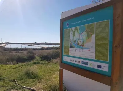 a sign on the side of a field at Ria Formosa Pineview in Faro