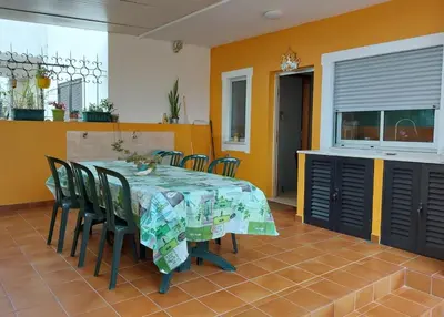 a dining room with a table and chairs at Ria Formosa Pineview in Faro