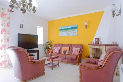 a living room with two couches and a tv at Ria Formosa Pineview in Faro