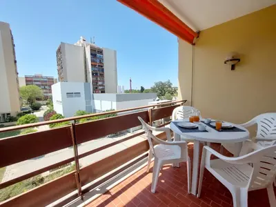 a balcony with a table and chairs on a roof at Loule Turtle by SAPvillas in Vilamoura