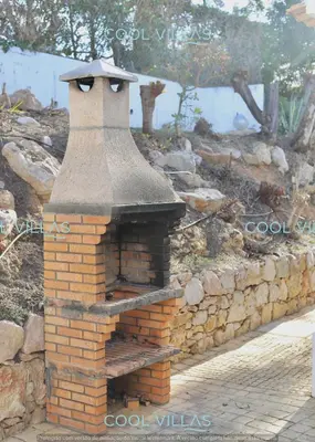a brick oven in a stone wall at Orquidea Senses - 6 Pax - Sea View in Albufeira