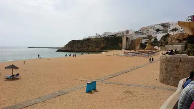 a small bathroom with a toilet and a sink at Apartment near the ocean Rua 5 de Outubro in Albufeira